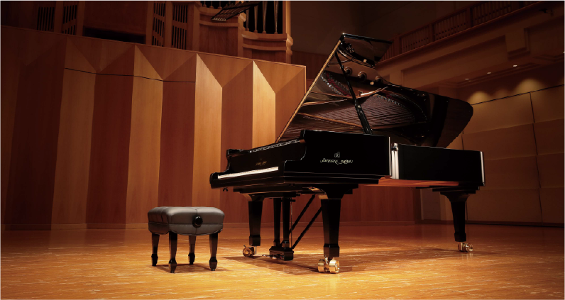 Kawai grand piano on stage in a concert hall