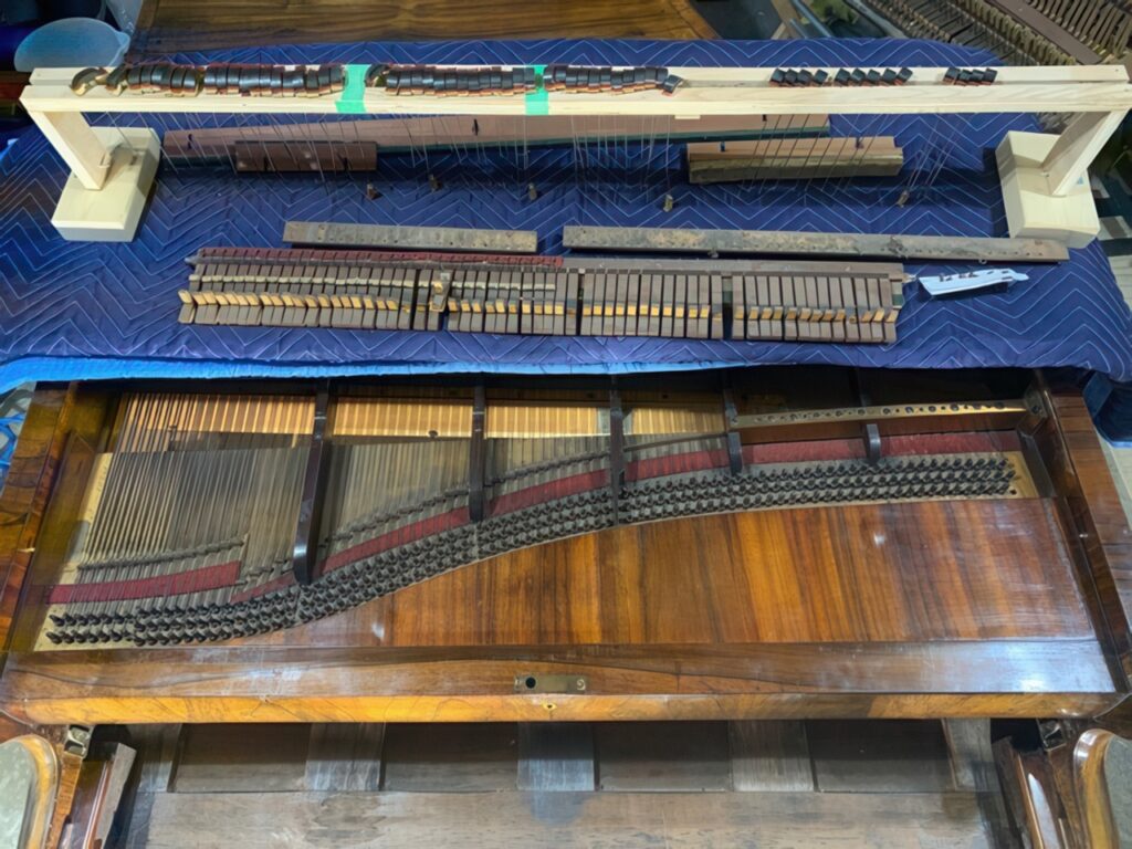 Custom piano rebuilds showcasing expert craftsmanship.